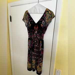 Perfect condition ECI sleeveless v neck black and flowery dress with bow size 10